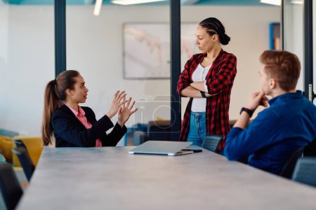 Photo for A team of successful programmers sits in a startup office, strategizing new business projects and solving existing challenges, showcasing innovation and collaboration in the tech industry. - Royalty Free Image