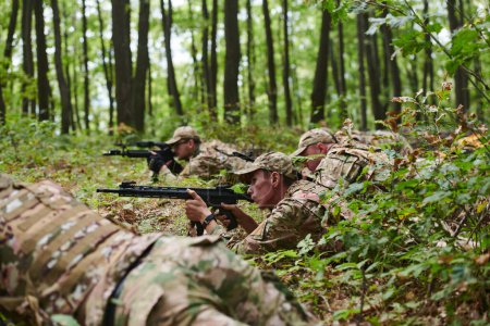 Elite soldiers stealthily maneuver through the dense forest, camouflaged in specialized gear, as they embark on a covert and strategic military mission. 