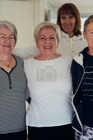 Photo for A vibrant community of senior women, guided by their instructor, embraces the enriching journey of yoga, fostering unity, well-being, and a shared commitment to active aging. - Royalty Free Image
