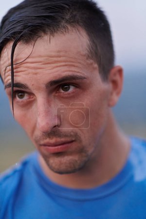 Photo for After completing a grueling daily run, a sweaty athlete takes a well-deserved rest, showcasing the physical exertion and dedication of their training regimen. - Royalty Free Image