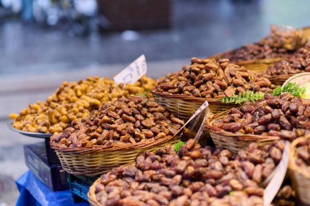 Photo for Freshly harvested dates, packed and ready for sale, offer a taste of autumn on the streets of Istanbul. - Royalty Free Image