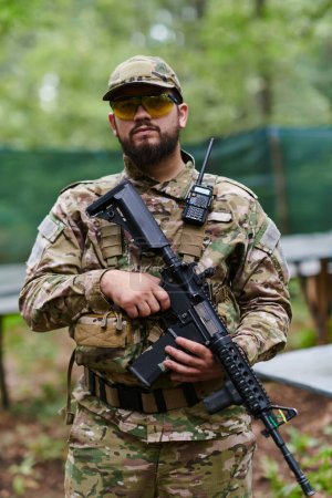  Elite soldier exudes focused determination and readiness, geared up for a perilous military operation, capturing the essence of courage and professionalism in the face of imminent danger. 