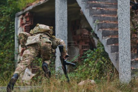 Photo for In a high stakes mission, a specialized military unit executes a tactical operation to secure a dangerous house where terrorists are believed to be hiding, showcasing precision and coordinated - Royalty Free Image