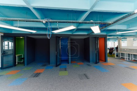 Photo for Photo of a modern office where programming, digital marketing and web design projects are done. Office with modern furniture and glass office. - Royalty Free Image
