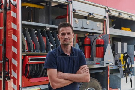 Confident firefighter stands with crossed arms, exuding resilience and preparedness, ready to respond to emergencies alongside a modern fire truck, showcasing the heroism and strength of the fire