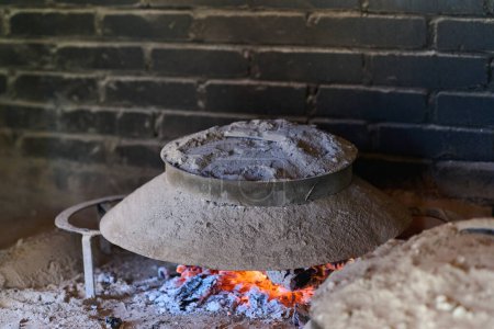 Capturing the essence of Bosnian culinary tradition, step-by-step preparation of a traditional Bosnian pie, showcasing the meticulous craftsmanship and authentic flavors involved in the culinary