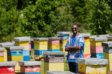  African American teenager clad in traditional Sudanese attire explores small beekeeping businesses amidst the beauty of nature