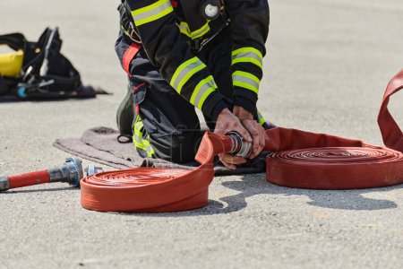 A firefighter dons the essential components of their professional gear, embodying resilience, commitment, and readiness as they gear up for a hazardous firefighting mission, a testament to their
