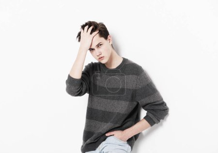 Photo for Young Male Model wearing casual pullover and jeans posing over white background - Royalty Free Image