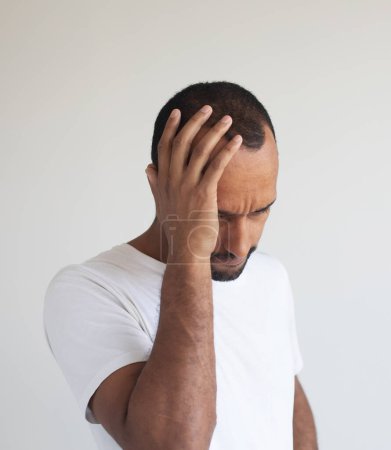 Photo for Stressed young african american man feel pain having terrible strong headache concept, tired upset black guy massaging temples suffering from migraine isolated on white grey studio blank background - Royalty Free Image