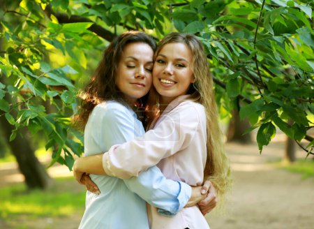 Photo for Mother With Adult Daughter In Park Together. Summer time. Lifestyle, family and people concept. - Royalty Free Image