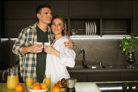 Photo for Lifestyle, love, family and people concept: young beautiful couple having breakfast - Royalty Free Image