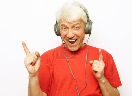 Photo for Photo of crazy optimistic old man listen music dance arms wear headphones isolated on white background. Dance with me. - Royalty Free Image
