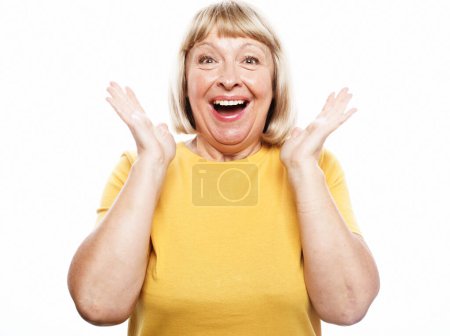 Photo for Old people, modern lifestyle, body language concept. Close-up portrait of shocked mature woman with short blond hair, looking at camera, isolated on white background - Royalty Free Image