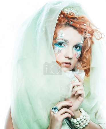 Photo for Party, christmas and people concept: Young beautiful redhead woman with bright creative make-up in New Year's style. Snow queen, fairy. Close-up portrait. - Royalty Free Image