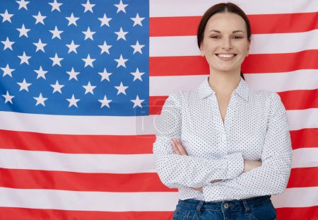Foto de Young english teacher woman on american flag background, education concept. - Imagen libre de derechos