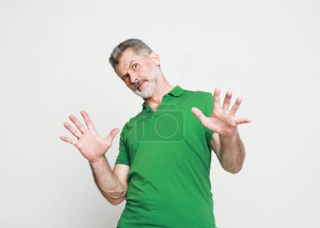 Photo for Emotion, lifestyle and old people concept: portrait senior bearded man, looking shocked, scared trying to protect himself in anticipation of unpleasant situation, isolated on grey background. - Royalty Free Image