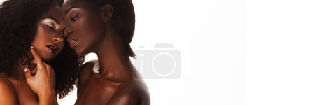 Foto de Beauty concept. Portrait of two beautiful african women standing together against a white background. Copy space. - Imagen libre de derechos
