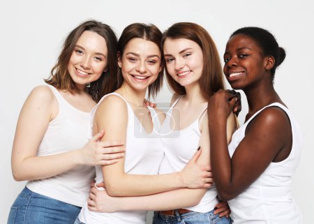 Photo for Lifestyle, friendship and people concept - group of four girls friends of different nationalities - Royalty Free Image