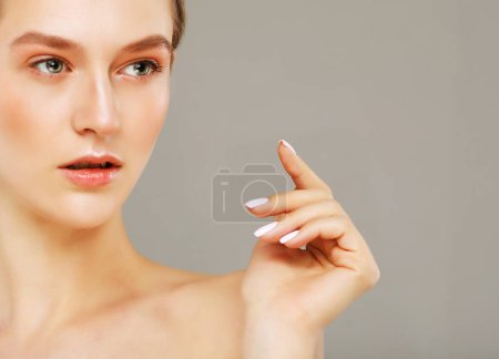 Photo for Closeup portrait of a face of the young attractive female with a healthy skin. Beautiful face of young white woman with a clean skin. Skin care concept. - Royalty Free Image