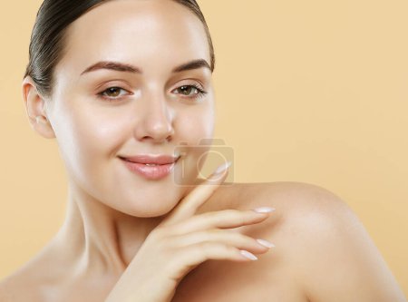 Photo for Beauty Woman face Portrait. Beautiful Spa model Female with Perfect Fresh Clean Skin. She looking at camera and smiling. Youth, beauty and Skin Care Concept. - Royalty Free Image