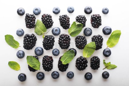 Photo for Mix berries patern over white background. Blackberries and blueberries. Close up. - Royalty Free Image