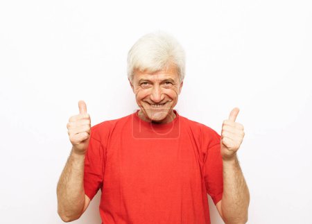 Photo for Emotion, lifestyle and old people concept: Portrait of energetic positive old grey haired man show okay sign - Royalty Free Image