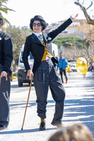 Foto de Palamos, Spain - february 20, 2023, Traditional carnival parade in a small town Palamos, in Catalonia, in Spain . - Imagen libre de derechos