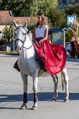 Photo for Traditional Hungarian harvest parade on September 16, 2023 in village Tapolca-Diszel of Hungary. Traditional hungarian clothes - Royalty Free Image