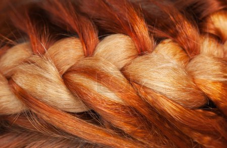 Photo for Beautiful, healthy, long, curly, red hair close-up. Braiding. Professional hair care. - Royalty Free Image