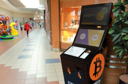Photo for Gdansk, Poland, March 21, 2023 Online currency Bitcoin vending machine cryptocurrency dispenser in shopping centre mall entrance, Europe - Royalty Free Image