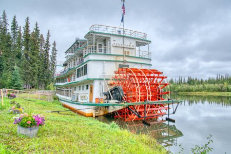 Photo for Fairbanks, Alaska - August 27, 2022: Riverboat Discovery III docked at the Chena Village in Fairbanks, Alaska. The stern wheel boat is owned by the Binkley family who run tours along the Chena River. - Royalty Free Image