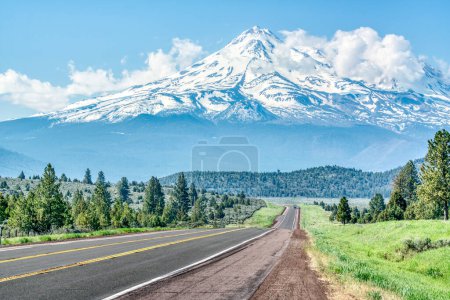 Photo for Long road leading towards Mt Shasta in the Cascade mountains in the Klamath National Forest of California - Royalty Free Image