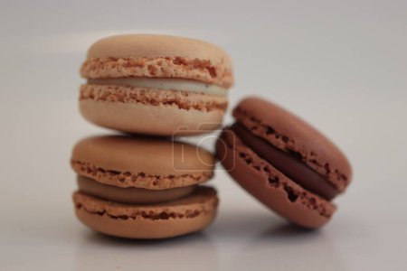Macarons in different shades of brown. Chocolate, mocca and coffee flavour