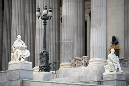 Photo for Two statues in front of the Austrian parliament in Vienna Austria - Royalty Free Image