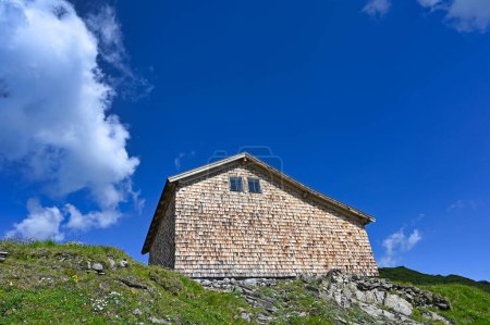 Photo for An old wooden house on top of a mountain in Bad Gastein Austria - Royalty Free Image