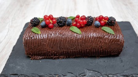 Photo for Chocolate and fruit roll cake - Royalty Free Image