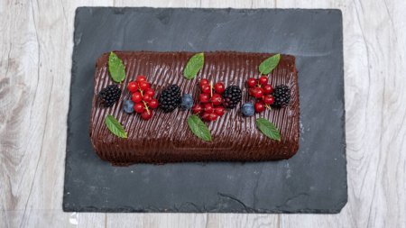 Photo for Homemade Chocolate and fruit roll cake - Royalty Free Image