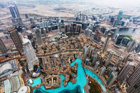 Dubai UAE aerial rooftop view from Burj Khalifa. Famous fountain and downtown