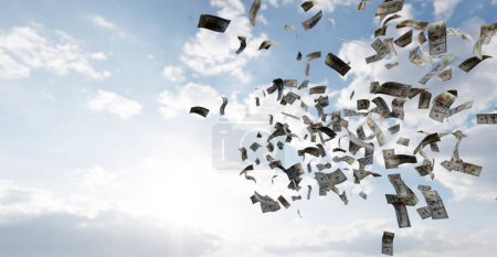 Money falling from sky - one hundred US dollar bills. Financial concept