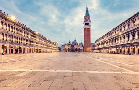 Piazza San Marco with basilica and Campanile tower in Venice, Italy at sunrise