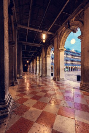 Arch columns on Saint Mark square in Venice, Italy at sunrise