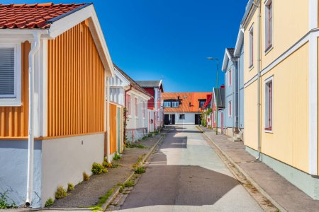 Scandinavian empty street with houses in colored wood in Karlskrona Sweden.