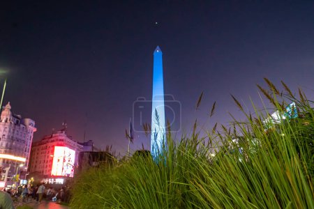 Photo for Buenos Aires, Argentina - 03/12/2022: An obelisk in national colors during the celebration of the victory of the Argentina national football team over the Australian team - Royalty Free Image
