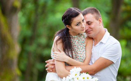Photo for Happy young couple in love outdoors in park - Royalty Free Image