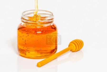 Photo for Jar with honey on white background - Royalty Free Image