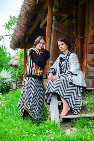 Photo for Young girls in national Ukrainian and Hungarian clothes - Royalty Free Image