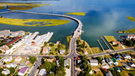 Photo for Chincoteague bridge across the Chincoteague Bay in Virginia and views of the waterfront. Drone view. - Royalty Free Image