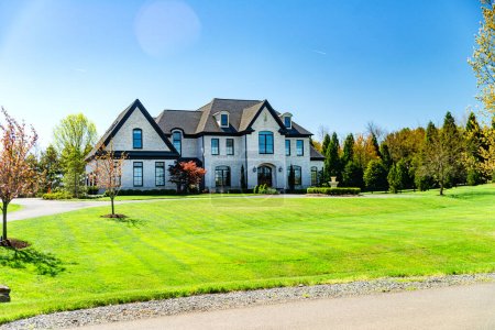 Photo for Big House suburb Single Family . Brick house with nice landscape and large green lawn. - Royalty Free Image