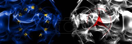 Photo for Flags of EU, European Union vs Japan, Japanese, Kiyosato, Hokkaido, Okhotsk, Subprefecture. Smoke flag placed side by side on black background. - Royalty Free Image